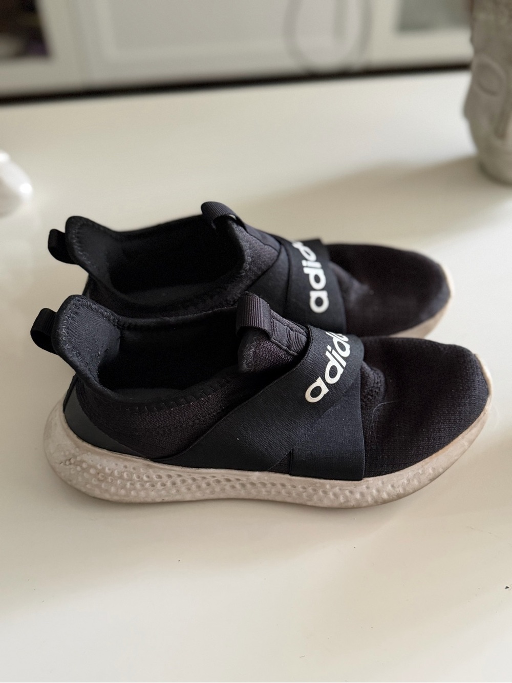 adidas women’s Black Slip-On Sneakers with White Sole